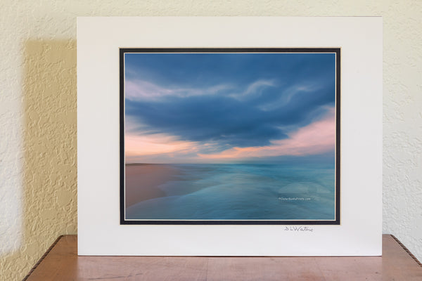 I captured this image by accident. I was standing at the waters edge with my tripod photographing when a large wave washed ashore, I had to grab the camera and run for it. This is how it turned out. This photo was taken at Frisco Beach on Cape Hatteras National Seashore.