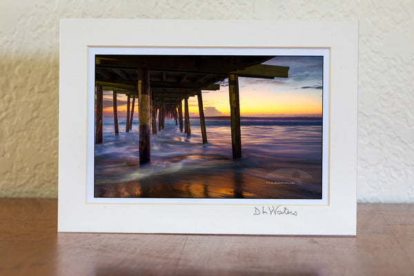 Long exposure under the Nags Head Fishing Pier just before sunrise. Nags Head Pier is one of the oldest and longest piers on the Outer Banks.It is one of the few Outer Banks piers to have a restrant.