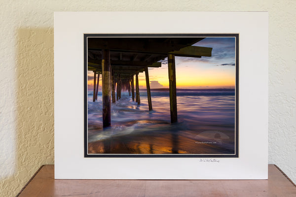 Long exposure under the Nags Head Fishing Pier just before sunrise. Nags Head Pier is one of the oldest and longest piers on the Outer Banks.It is one of the few Outer Banks piers to have a restrant.