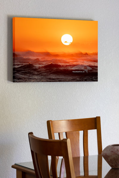 Sunset from Cape Point on Cape Hatteras Island looking towards Hatteras Village across a firey windsweept sea.