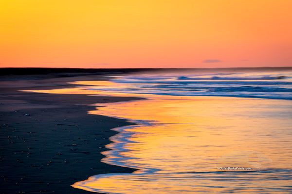 A longer exposure showing the motion in the waves at Frisco Beach in Cape Hatteras National Seashore on the Outer Banks of North Carolina.