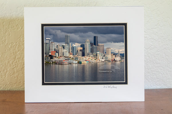 Seattle skyline on a stormy afternoon. The light had just broken through the clouds, making the skyline stand out from the dark clouds.