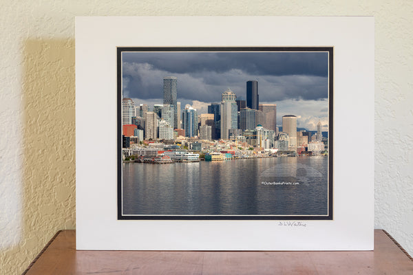 Seattle skyline on a stormy afternoon. The light had just broken through the clouds, making the skyline stand out from the dark clouds.