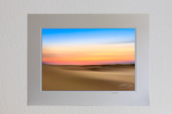 13 x 19 luster print in 18 x 24 ivory mat of An impression of Jockey's Ridge State Park at sunset. Moving the camera while the shutter is open creates impressionistic photographs.