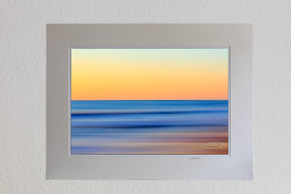 13 x 19 luster print in 18 x 24 ivory mat of A Outer Banks beach sunrise reduced to colors and lines. Using camera movement during a long exposure to blur the beach and ocean.