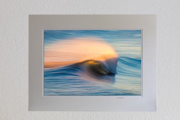 13 x 19 luster print in 18 x 24 ivory mat of Windblown spray from the surf, back lit by the rising sun in Kill Devil Hills on the Outer Banks of North Carolina.
