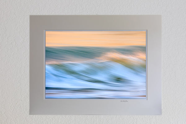 13 x 19 luster print in 18 x 24 ivory mat of Long shutter speed showing the motion of the surf at sunrise on the Outer Banks.