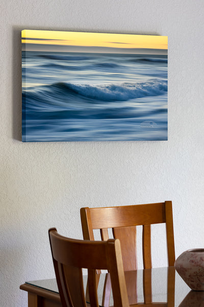 20"x30" x1.5" stretched canvas print hanging in the dining room of Motion of the early morning surf at Kitty Hawk on the Outer Banks of NC.