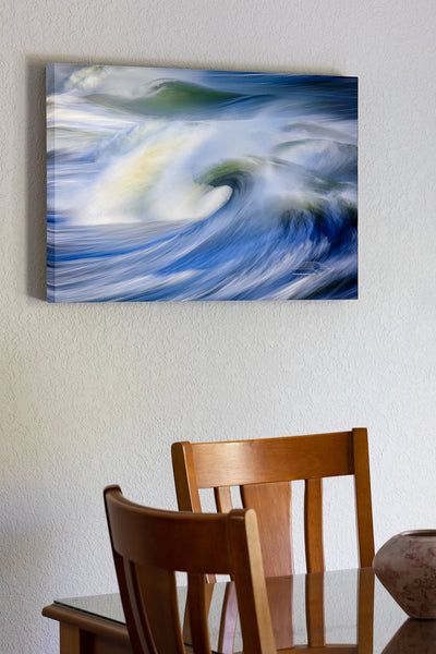 20"x30" x1.5" stretched canvas print hanging in the dining room of Huge waves captured with a slow shutter speed to show movement from the end of Avalon Fishing Pier in kill Devil Hills on the Outer Banks of North Carolina.