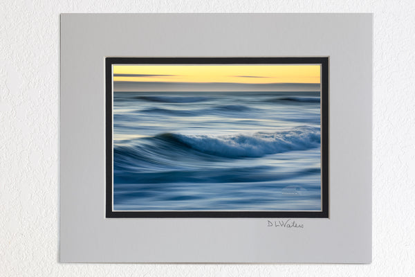 5 x 7 luster prints in a 8 x 10 ivory and black double mat of  Motion of the early morning surf at Kitty Hawk on the Outer Banks of NC.