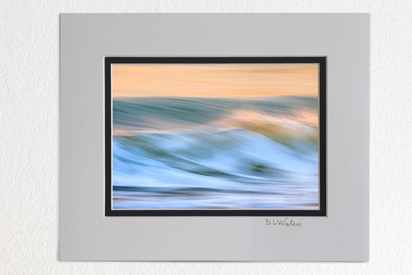 5 x 7 luster prints in a 8 x 10 ivory and black double mat of  Long shutter speed showing the motion of the surf at sunrise on the Outer Banks.