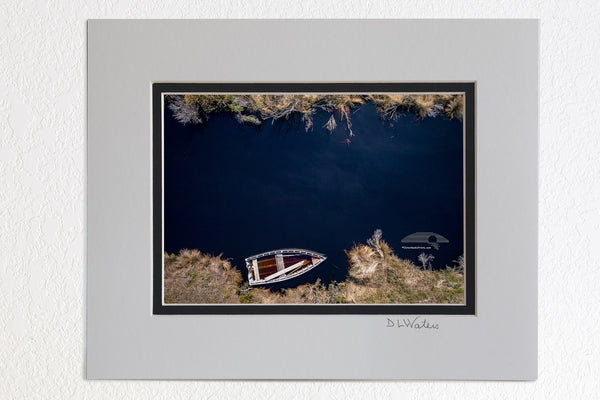 Aerial photo of a wooden skiff on a creek off the Albemarle Sound in Alligator River Wildlife Refuge.