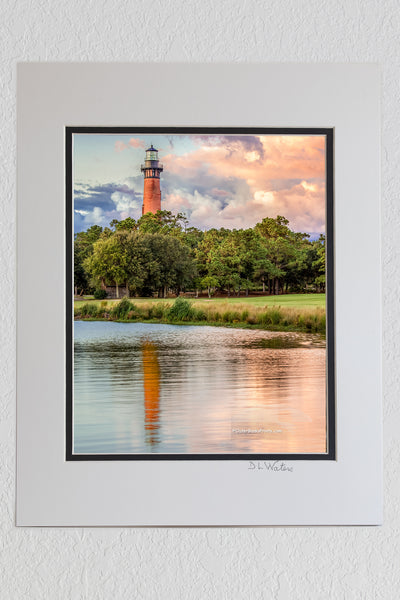 8 x 10 luster print in a 11 x 14 ivory and black double mat of A beautiful afternoon that the Corolla NC lighthouse on the Outer Banks.