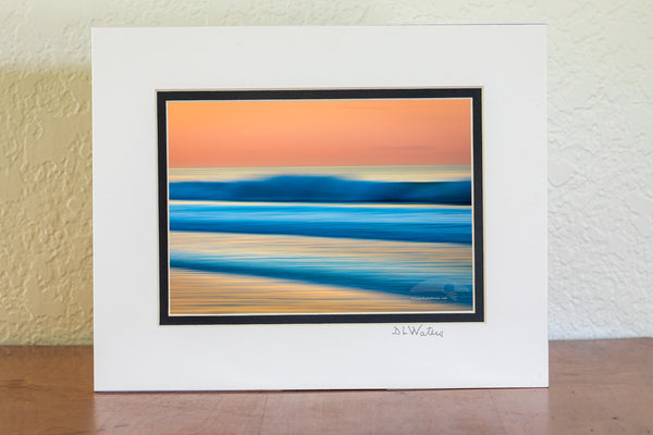 This is an impressionistic long exposure while moving the camera on a beautiful morning sunrise at Cape Hatteras National Seashore in Frisco on the Outer Banks of North Carolina.