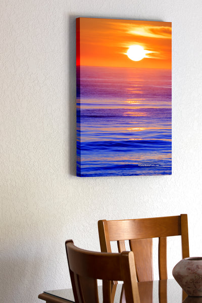 20"x30" x1.5" stretched canvas print hanging in the dining room of Sunrise over the Atlantic Ocean in Kitty Hawk North Carolina.