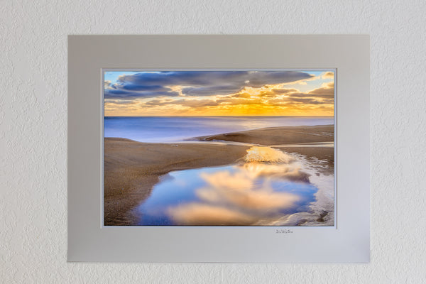 13 x 19 luster print in 18 x 24 ivory mat of A tide pool at Kitty Hawk beach on the Outer Banks of NC reflecting a tranquil sunrise.