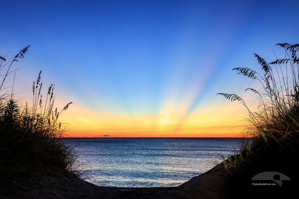 Dawn light rays on a Outer Banks beach in Duck NC.