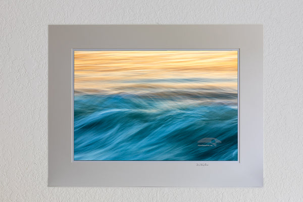 13 x 19 luster print in 18 x 24 ivory mat of Like musical notes moving across the sea, this photograph of the surf was captured with a long exposure at sunrise on the Outer Banks of NC.