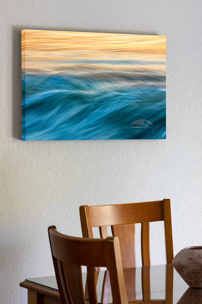 20"x30" x1.5" stretched canvas print hanging in the dining room of Like musical notes moving across the sea, this photograph of the surf was captured with a long exposure at sunrise on the Outer Banks of NC.