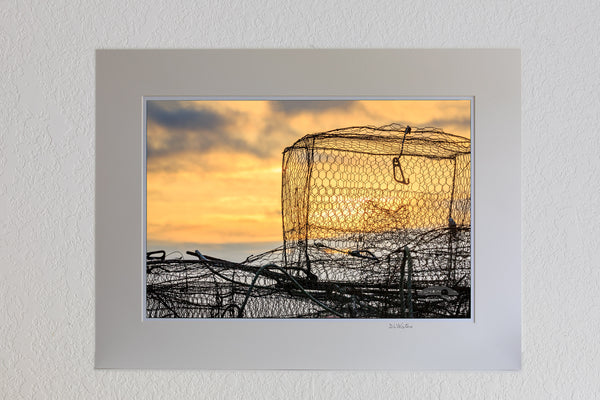 13 x 19 luster print in 18 x 24 ivory mat of Crab traps piled on the dock at sunrise waiting to be set.