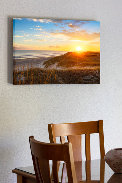Sun setting over sanddunes along the Frisco costline in Cape Hatteras National Seashore, NC.