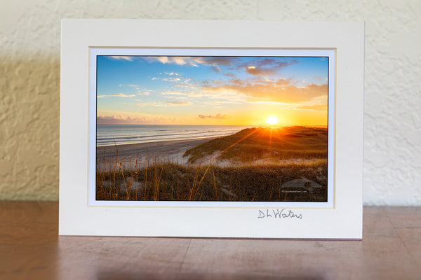Sun setting over sanddunes along the Frisco costline in Cape Hatteras National Seashore, NC.