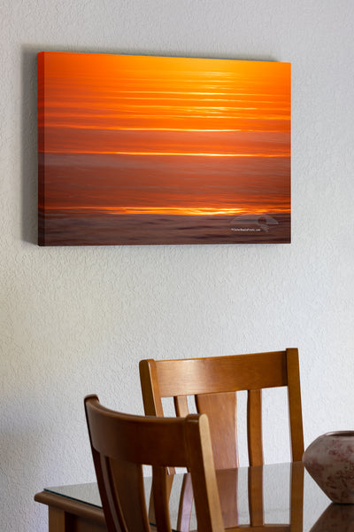 20"x30" x1.5" stretched canvas print hanging in the dining room of Kitty Hawk Surf at sunrise with a long shutter speed and camera movement.