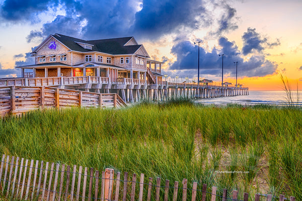 Sand fence, sea oats, and sunrise at Jennette's Pier Nags Head, North Carolina.