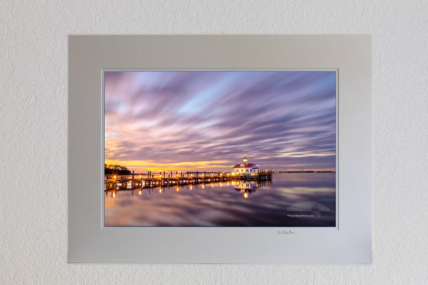 This two minute long exposure before sunrise shows the clouds moving past Roanoke Marshes Lighthouse in Manteo on the Outer Banks of North Carolina. This  lighthouse is a replica of a river lighthouse that was located at in the sound in Wanchese