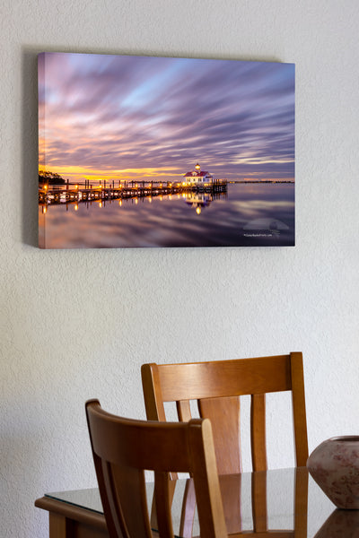 This two minute long exposure before sunrise shows the clouds moving past Roanoke Marshes Lighthouse in Manteo on the Outer Banks of North Carolina. This  lighthouse is a replica of a river lighthouse that was located at in the sound in Wanchese