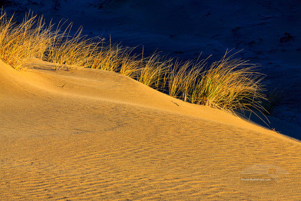 Sand dunes and dramatic clouds at Jockey's Ridge State Park  Nags Head NC. I Jockys Ridge is the largest sandune on the east coast.