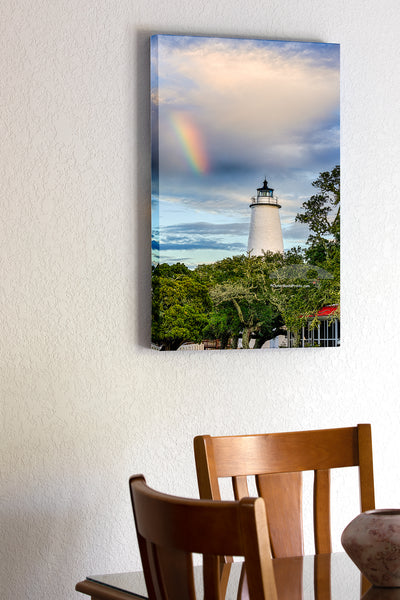 20"x30" x1.5" stretched canvas print hanging in the dining room of Ocracoke Lighthouse and a rainbow as the morning storm clears.