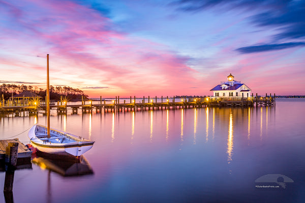 Roanoke Marshes Lighthouse and Shallowbag Bay at sunrise in Manteo on the Outer Banks of NC.