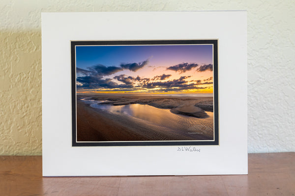 This is in Buxton North Carolina on the beach next to the Cape Hatteras Lighthouse. I love photographing the beach because every time you go you have a new landscape to photograph