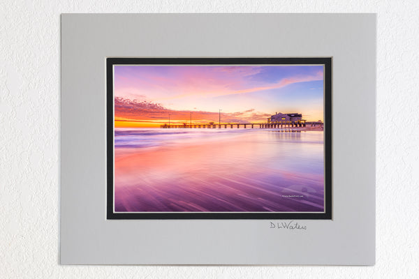 5 x 7 luster prints in a 8 x 10 ivory and black double mat of Sunrise colors reflect off shallow waves as they slide back into the sea at Jennette's Pier.