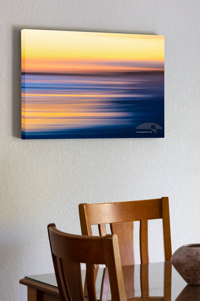 Intentional camera movement to create long streaks of light at sunset along Frisco beach in Cape Hatteras National Seashore, NC.