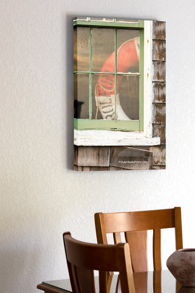 20"x30" x1.5" stretched canvas print hanging in the dining room of Picture of a old window and lifesaver at Chicamacomico Lifesaving Satiation on Hatteras Island.