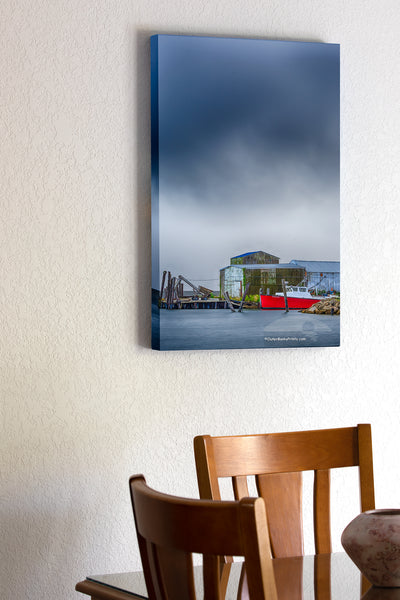 Red boat with a approaching storm at Wanchese Harbor Outer Banks NC.