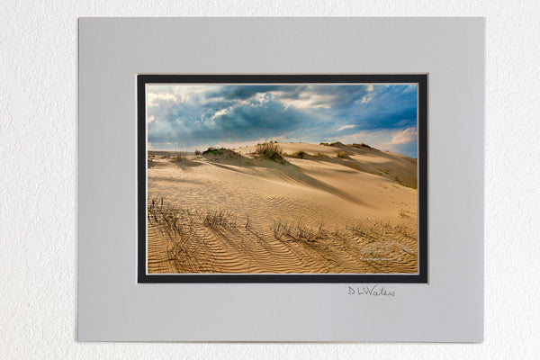 5 x 7 luster prints in a 8 x 10 ivory and black double mat of  Sand dunes and dramatic clouds at Jockey's Ridge State Park Nags Head NC. I Jockys Ridge is the largest sandune on the east coast.