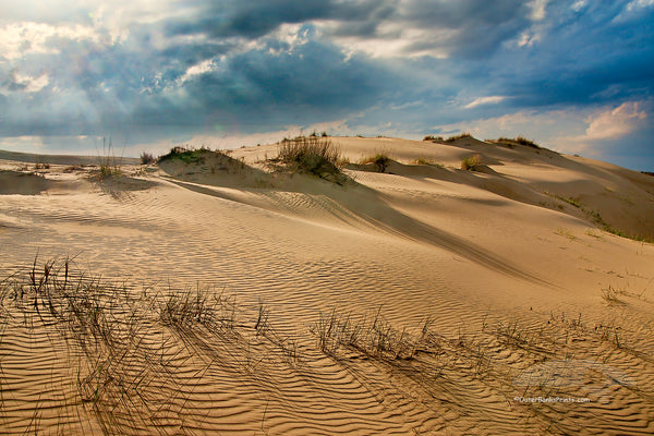 Sand dunes and dramatic clouds at Jockey's Ridge State Park  Nags Head NC. I Jockys Ridge is the largest sandune on the east coast.