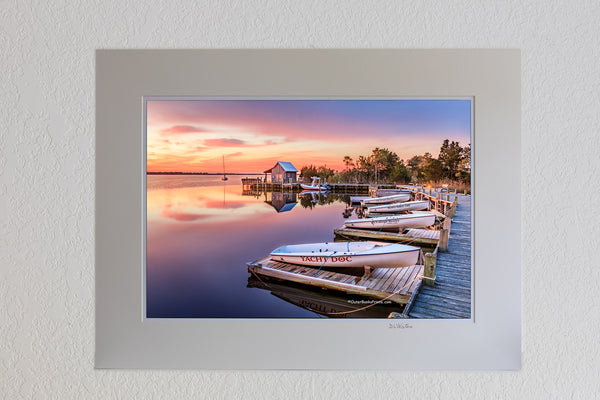 13 x 19 luster print in 18 x 24 ivory mat of Sunrise at Shallow Bag Bay waterfront in Manteo on the Outer Banks of NC.