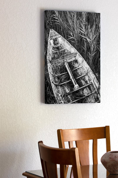 An abandon skiff in the reeds along the Manteo waterfront on the Outer Banks in NC. I set the self timer on my camera and held my tripod high above my head to capture this photograph. I felt this one look best in black-and-white.