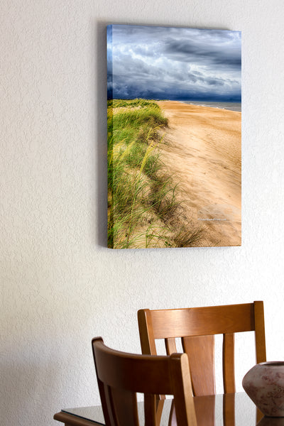 20"x30" x1.5" stretched canvas print hanging in the dining room of Approaching storm over sea oats on a Cape Hatteras beach.