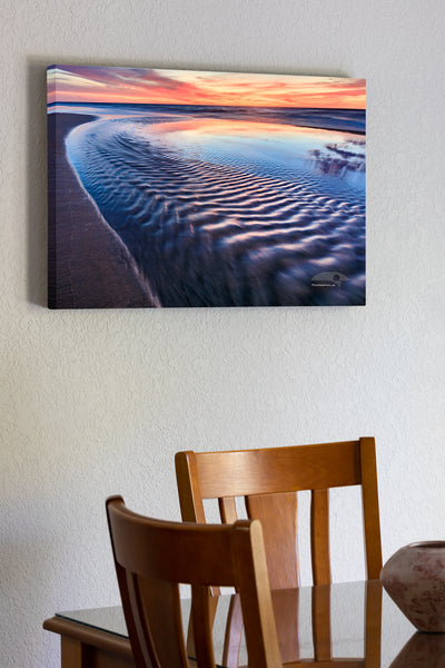 20"x30" x1.5" stretched canvas print hanging in the dining room of Sea water from a tie pool flowing back into the ocean just before sunrise at a Corolla beach on the Outer Banks of NC.