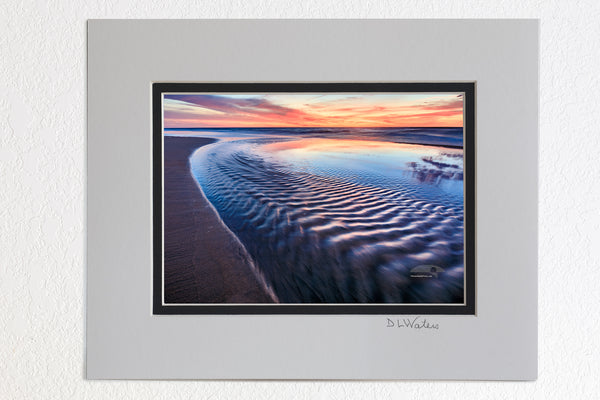5 x 7 luster prints in a 8 x 10 ivory and black double mat of Sea water from a tie pool flowing back into the ocean just before sunrise at a Corolla beach on the Outer Banks of NC.