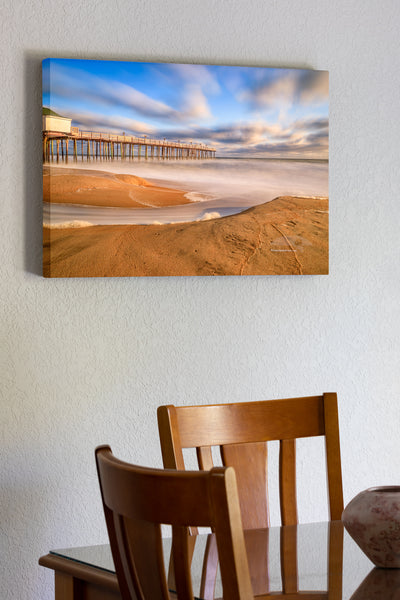 20"x30" x1.5" stretched canvas print hanging in the dining room of Long exposure of Nags Head Fishing Pier in Nags Head on the Outer Banks of NC.