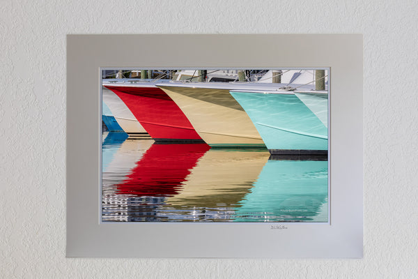 A line of fishing boats and reflections at Hatteras Harbor Marina.