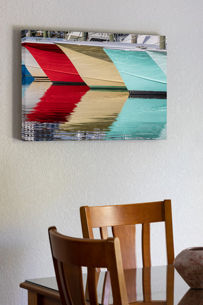 A line of fishing boats and reflections at Hatteras Harbor Marina.
