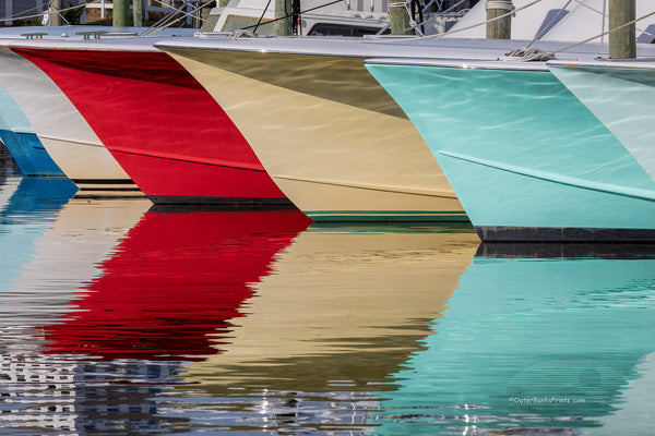 A line of fishing boats and reflections at Hatteras Harbor Marina.
