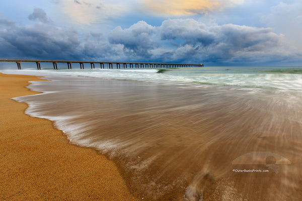 Surf and the Army Corps of Engineers Research Pier in Duck NC at sunrise.